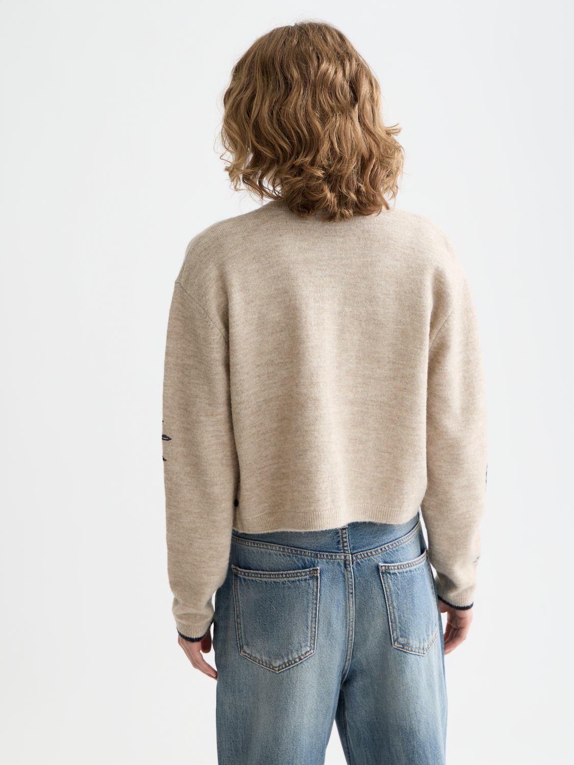 Scarlet embroidered crew neck cardigan by Scotch & Soda, showing detailed knitwear with intricate embroidery on the back.