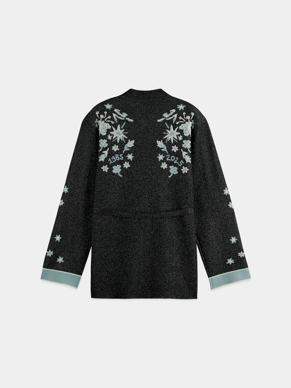 Back view of a stylish Scotch & Soda jacquard knitted jacket, showcasing intricate knit patterns and cozy knitwear design.