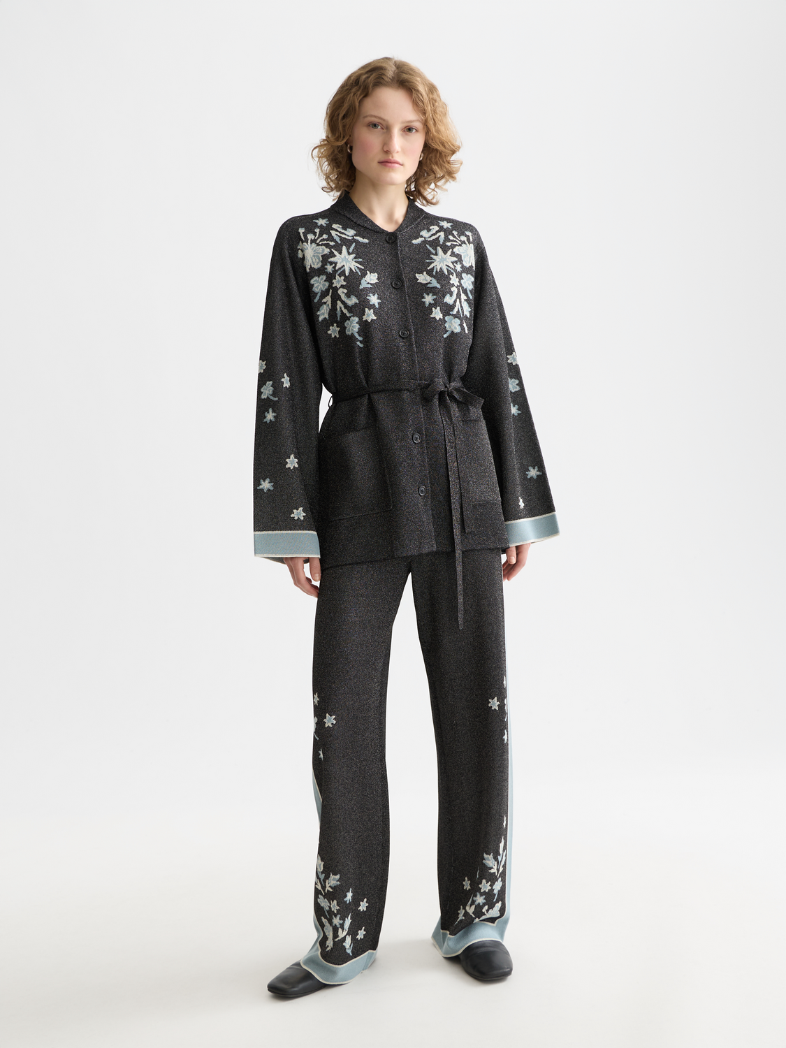 Scotch & Soda Jacquard knitted jacket featuring intricate knit patterns and a classic fit, displayed on a neutral background.