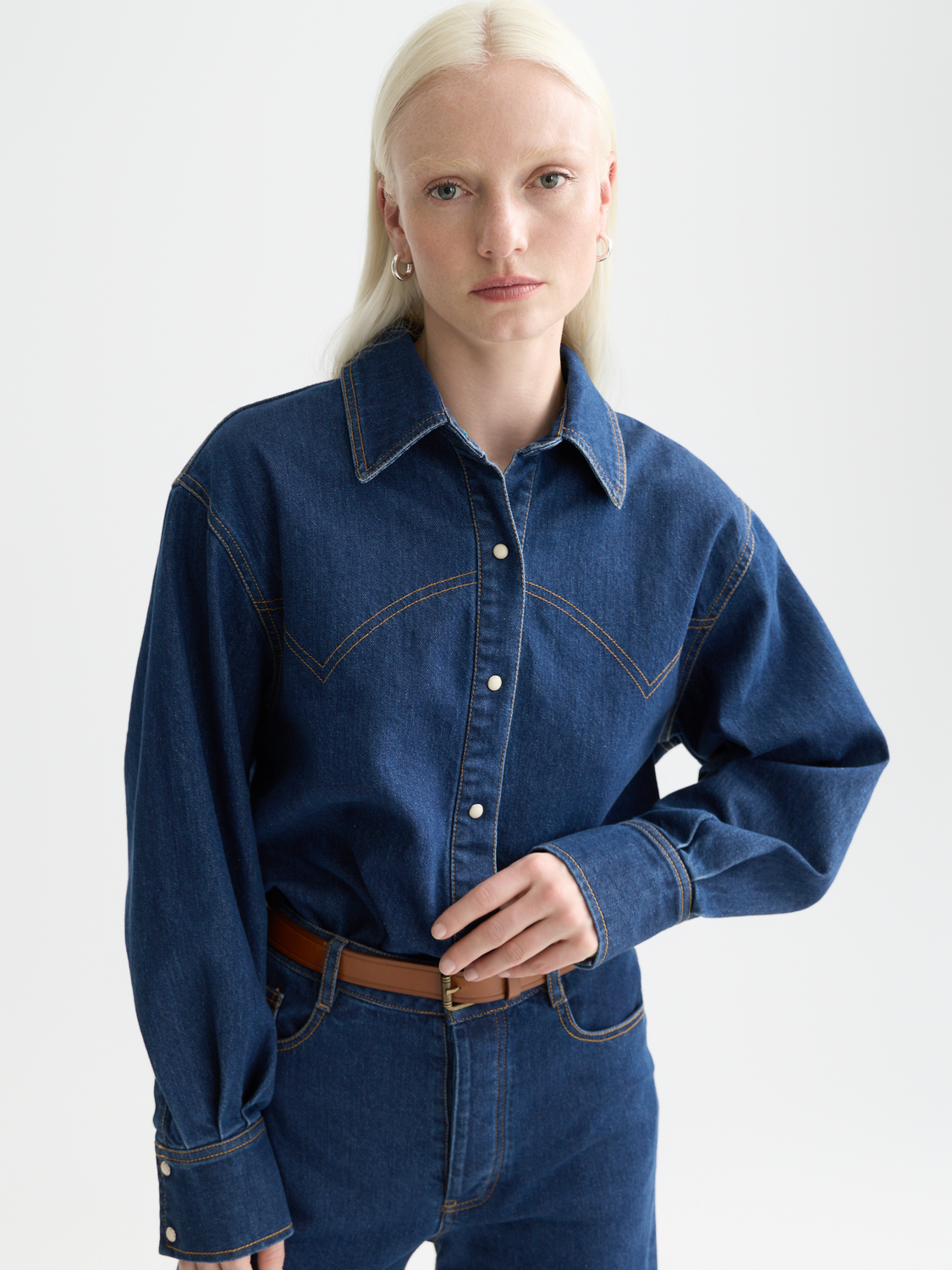 Long sleeve denim shirt by Scotch & Soda with button-front and classic collar, shown on a model.