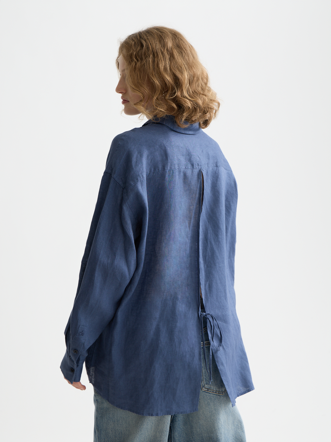 Long-sleeve linen shirt by Scotch & Soda, shown from the back with a relaxed fit and casual style.