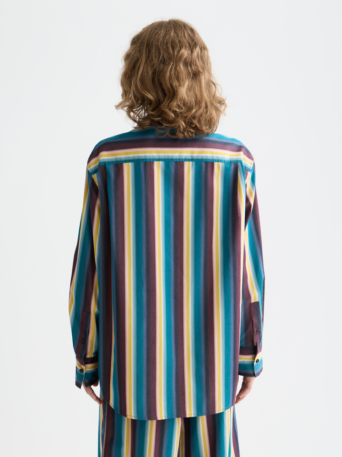 Long-sleeve striped shirt by Scotch & Soda with relaxed fit, featuring blue and white horizontal stripes, back view.