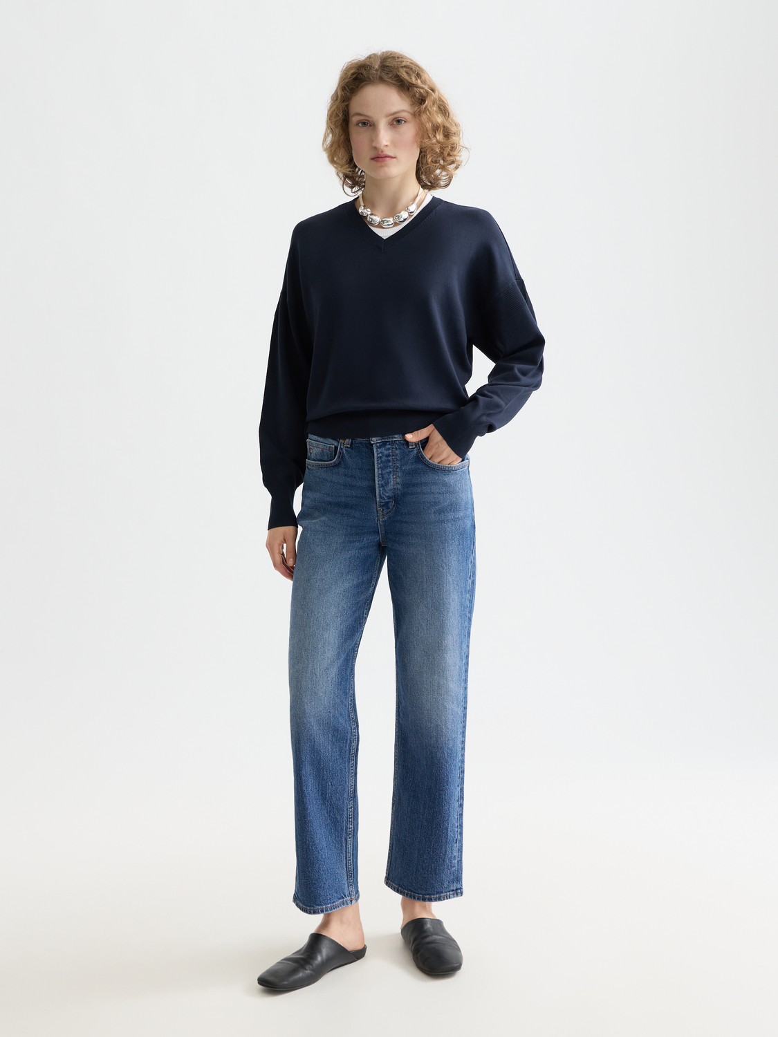 Light beige V-neck relaxed fit knit pullover by Scotch & Soda, showing a close-up of the soft, comfortable knit fabric.