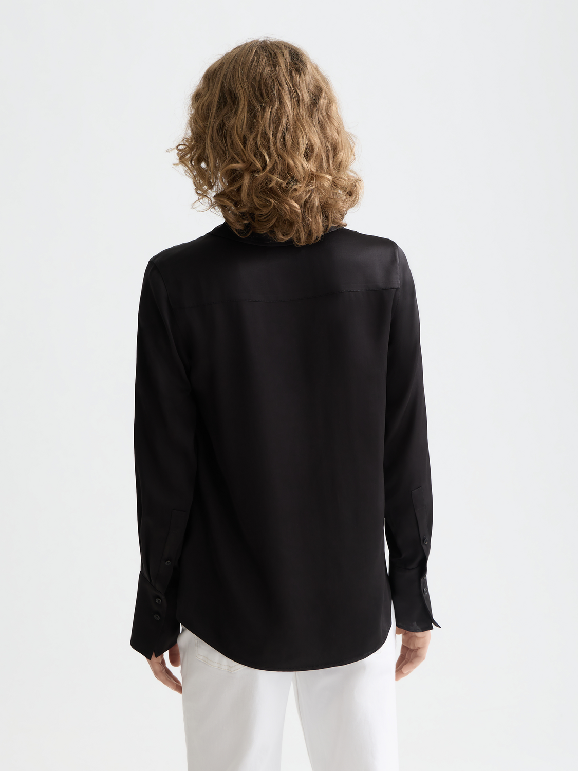 Long-sleeve satin shirt by Scotch & Soda, shown from the back with a smooth, shiny fabric and classic collar detail.