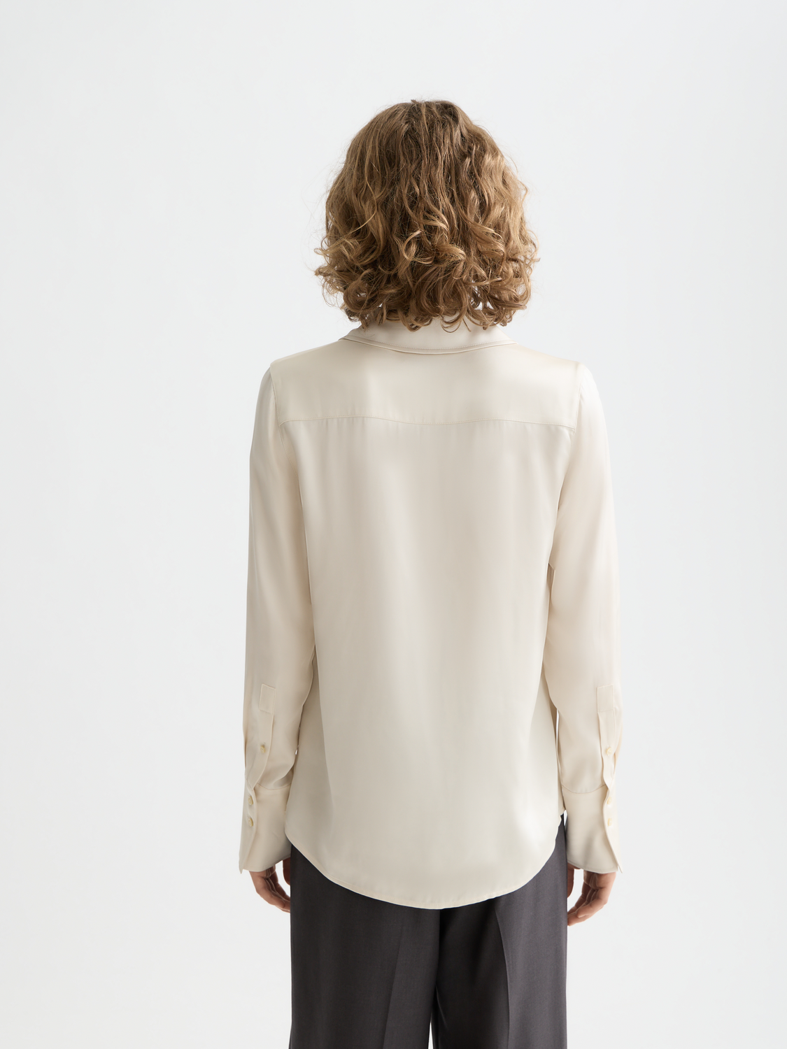Long sleeve satin shirt by Scotch & Soda, featuring a smooth fabric, classic collar, and button front, shown from the back.