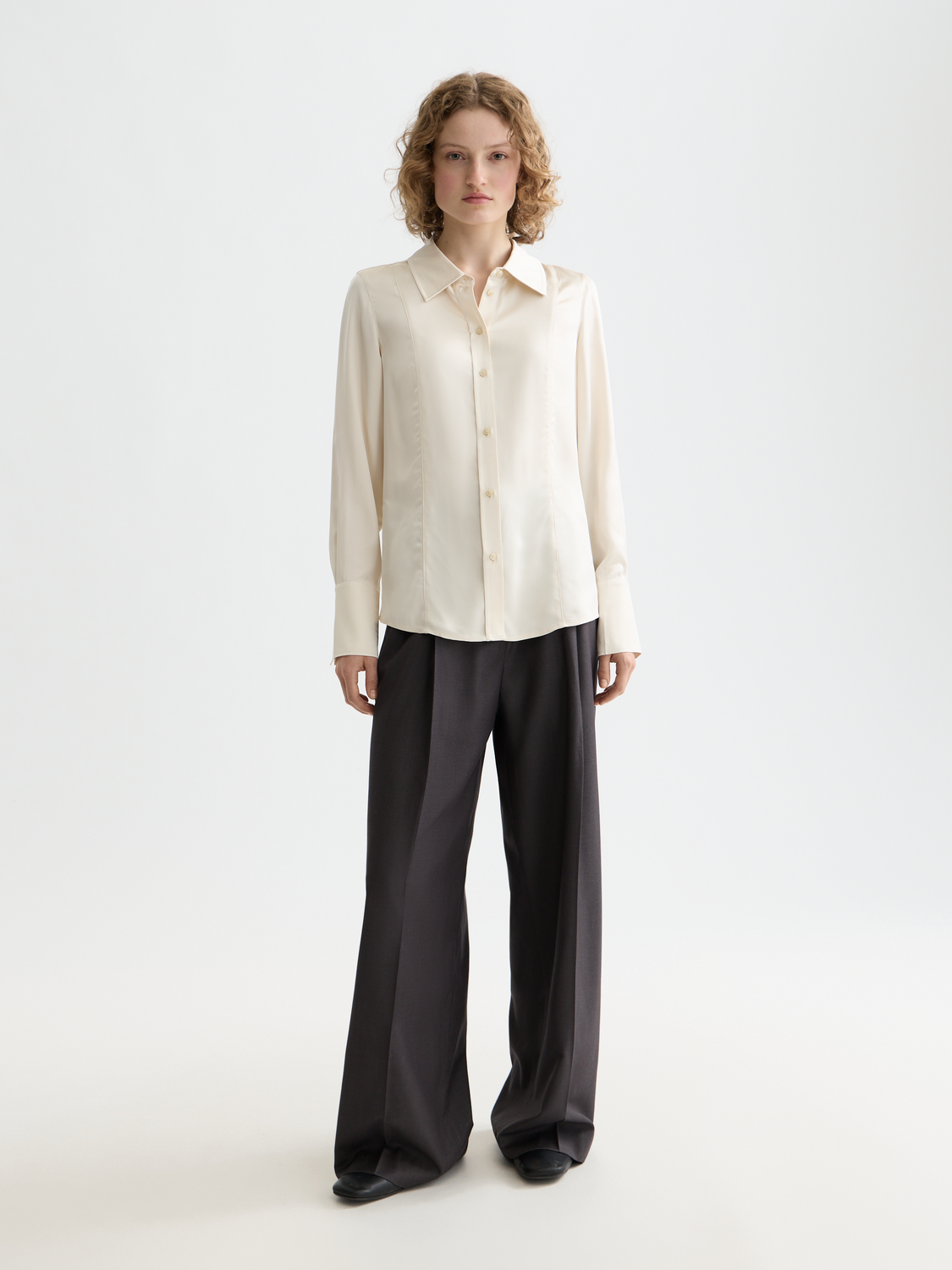 Long-sleeve satin shirt by Scotch & Soda, featuring smooth fabric and tailored fit, displayed on a hanger.