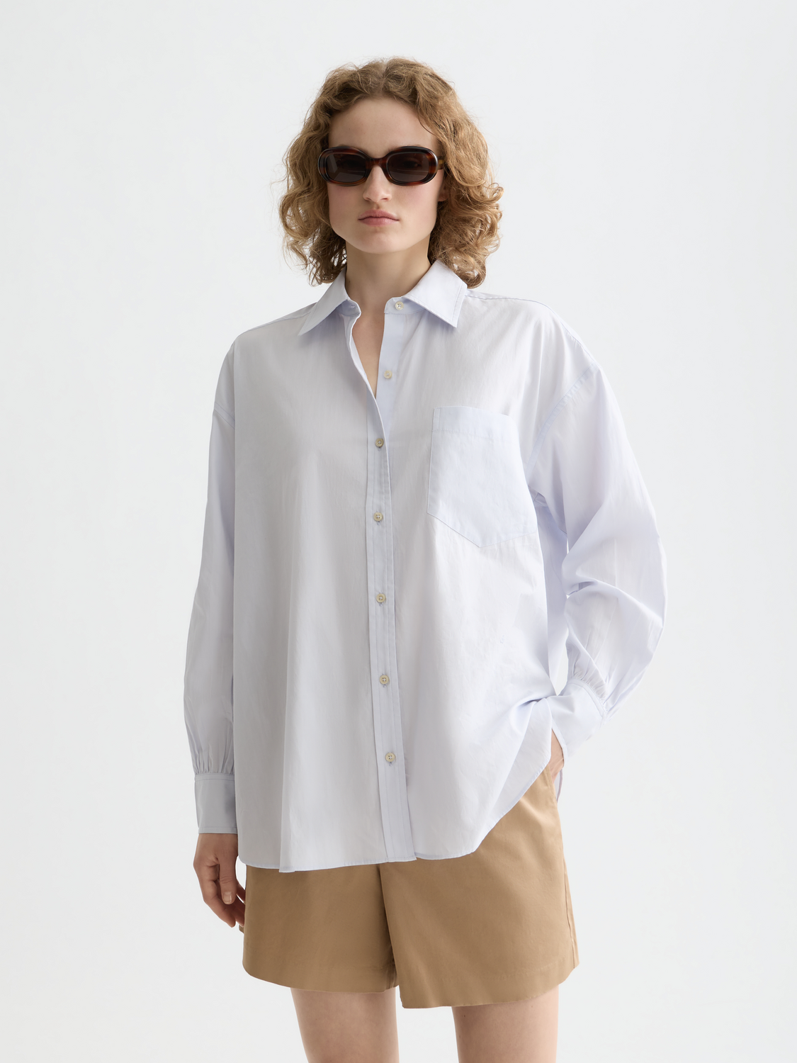 Long-sleeve Scotch & Soda girlfriend poplin shirt with button front and classic fit, shown in a natural fabric and stylish design.