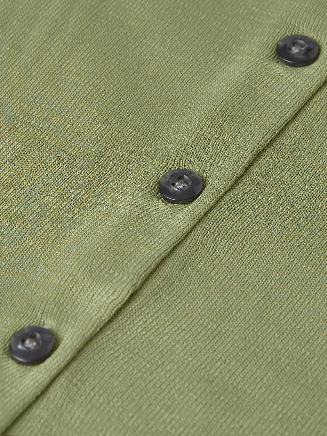 Cream crewneck cardigan from Scotch & Soda, soft knitwear with ribbed cuffs and hem, displayed on a hanger.