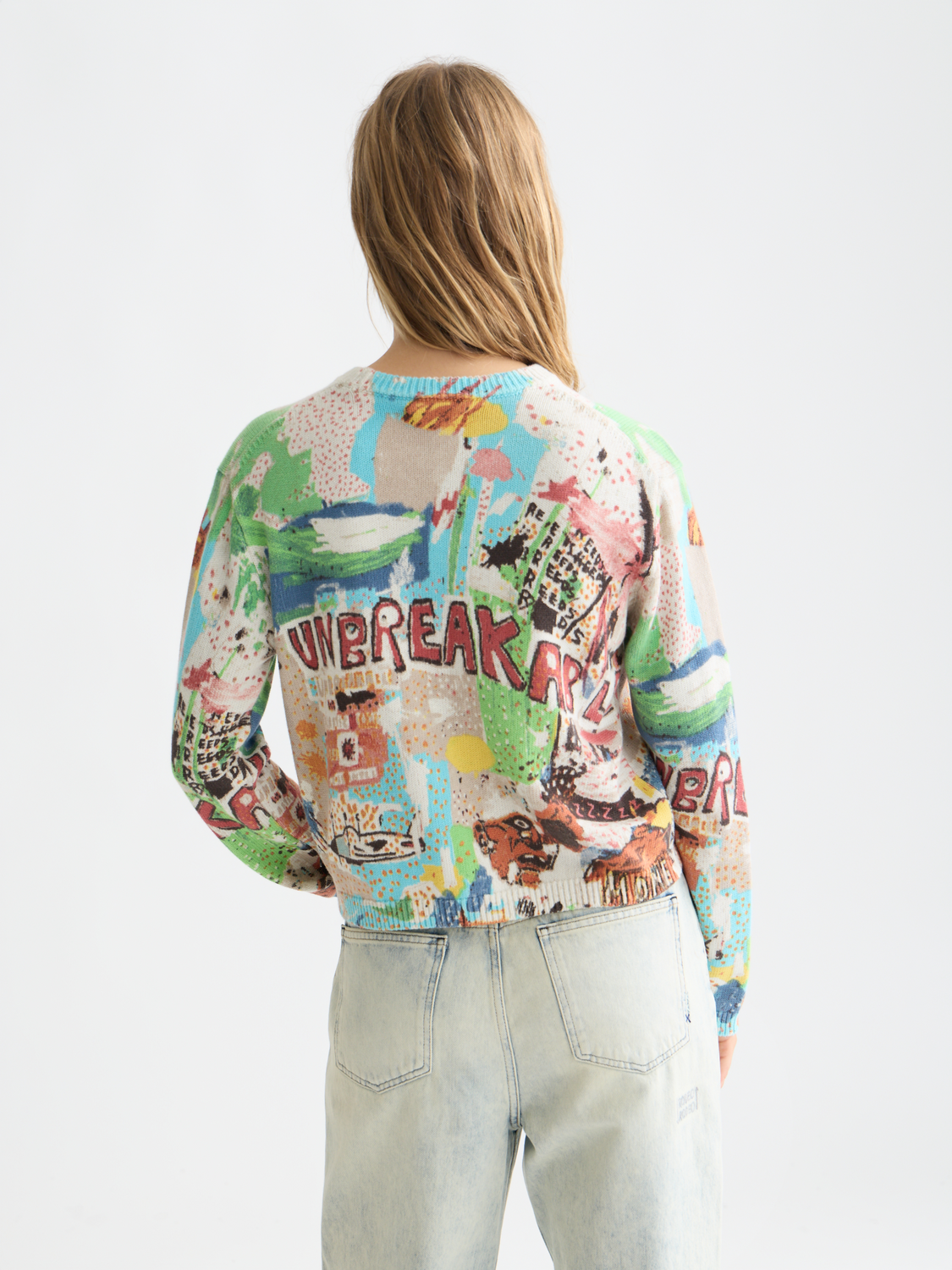 Scotch & Soda S&S x Basquiat printed pullover knitwear featuring bold artwork on the back, shown from the rear view.