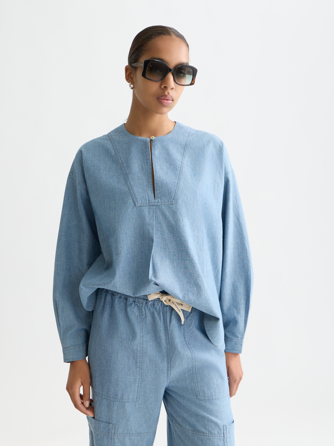 Denim bib shirt by Scotch & Soda, woven top featuring a classic denim design with bib front and button details.