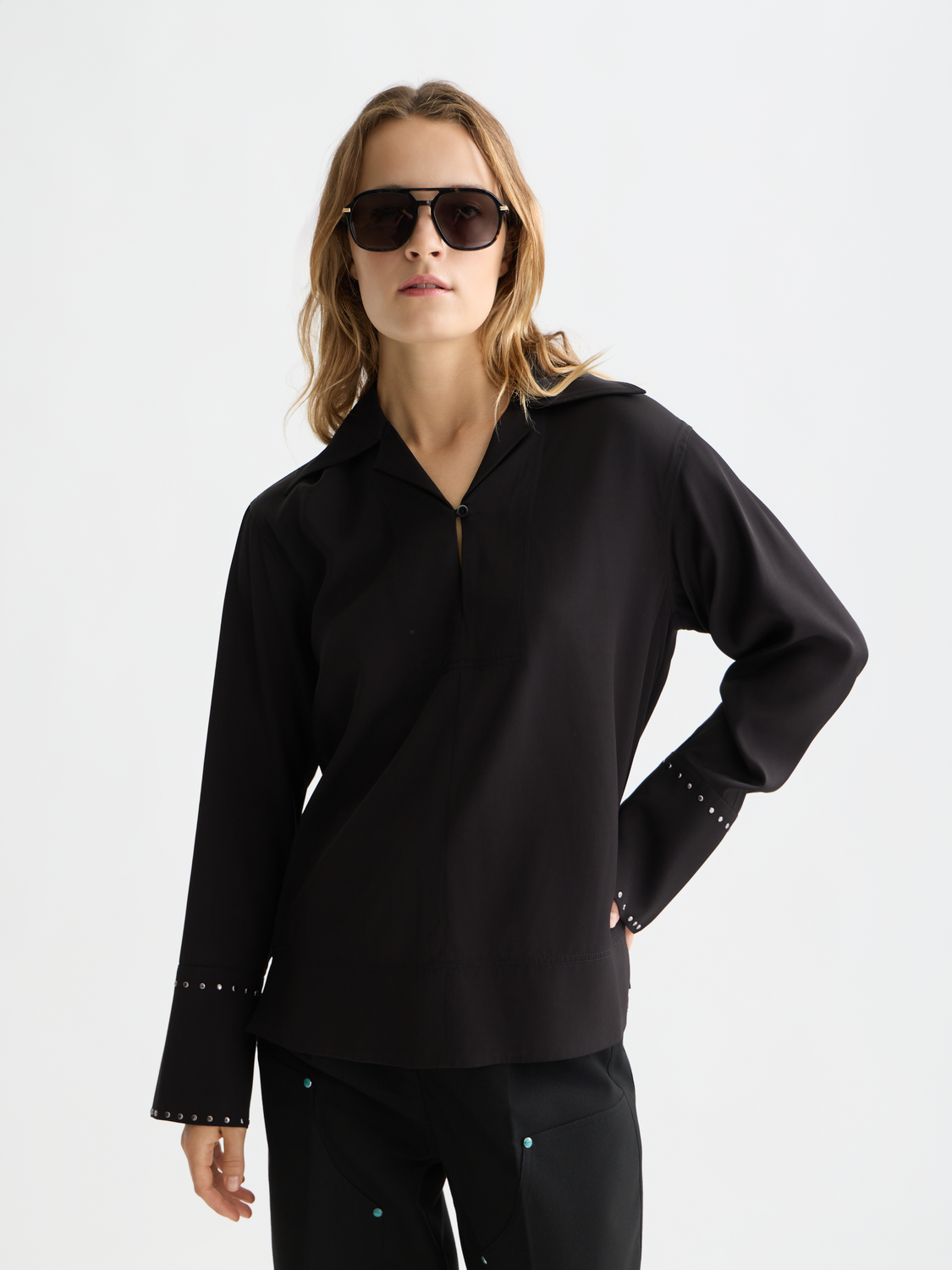 Black woven studded shirt by Scotch & Soda with metal accents, front view showing detailed design and button closure.