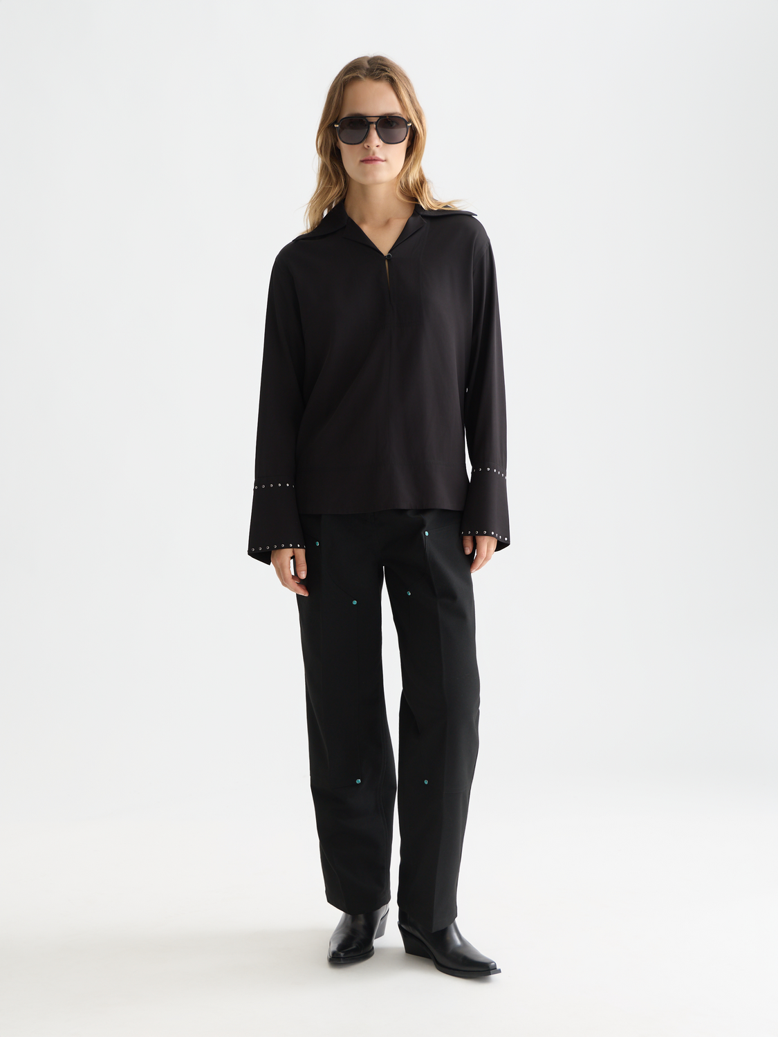 Black woven studded shirt by Scotch & Soda featuring metal stud accents on the front.