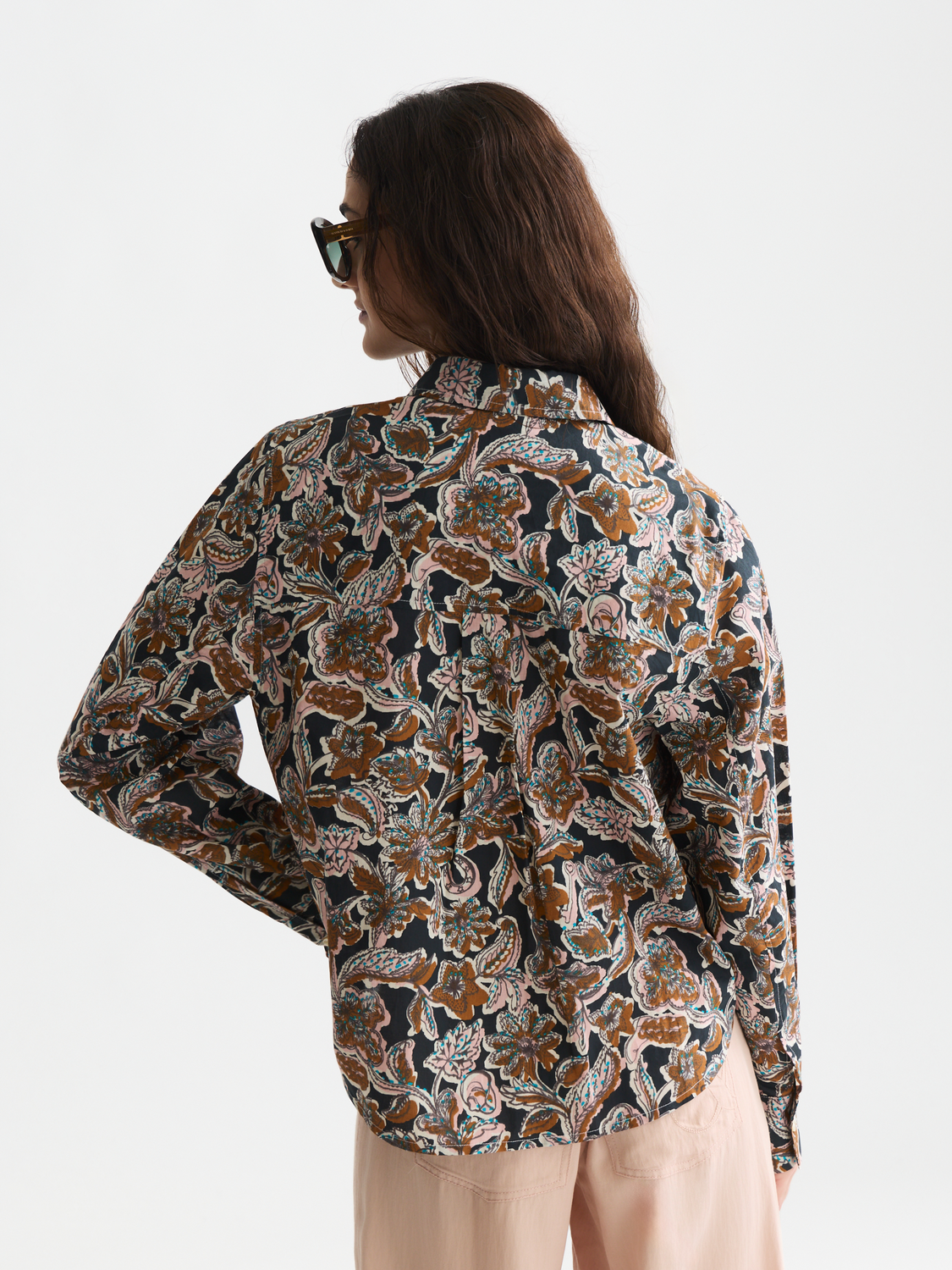Long sleeve printed shirt by Scotch & Soda featuring a vibrant, detailed design on the back and classic collar.