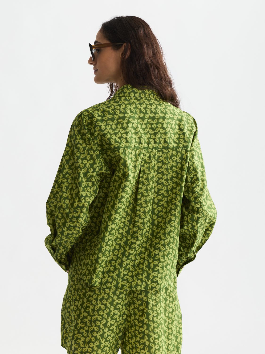 Long-sleeve printed shirt by Scotch & Soda featuring a vibrant pattern and classic fit, shown from the back view.