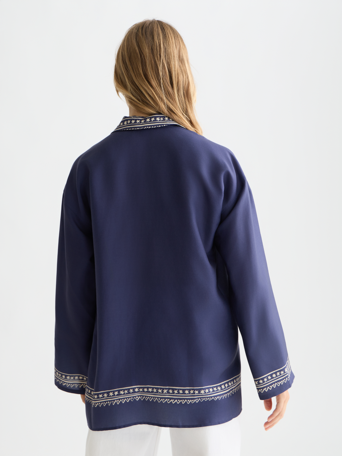 Long-sleeve printed shirt by Scotch & Soda featuring a vibrant, colorful design on the back.