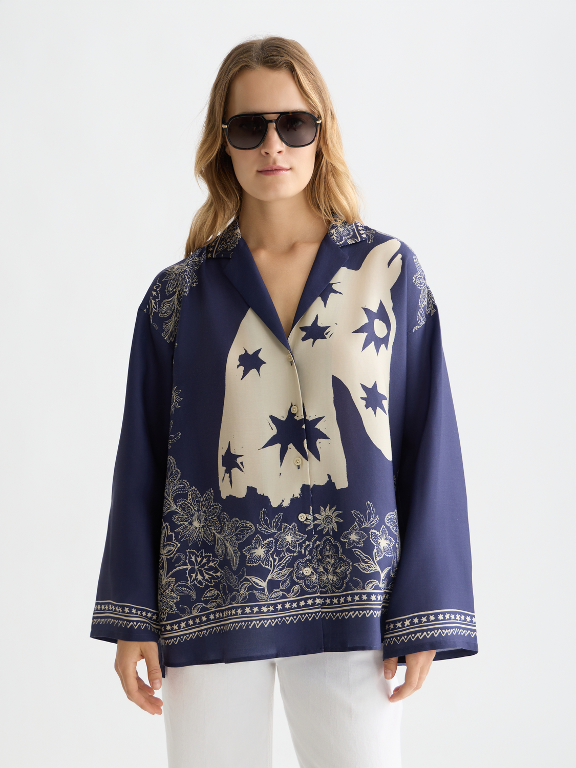 Long-sleeve printed shirt by Scotch & Soda featuring a vibrant, artistic design on soft fabric.