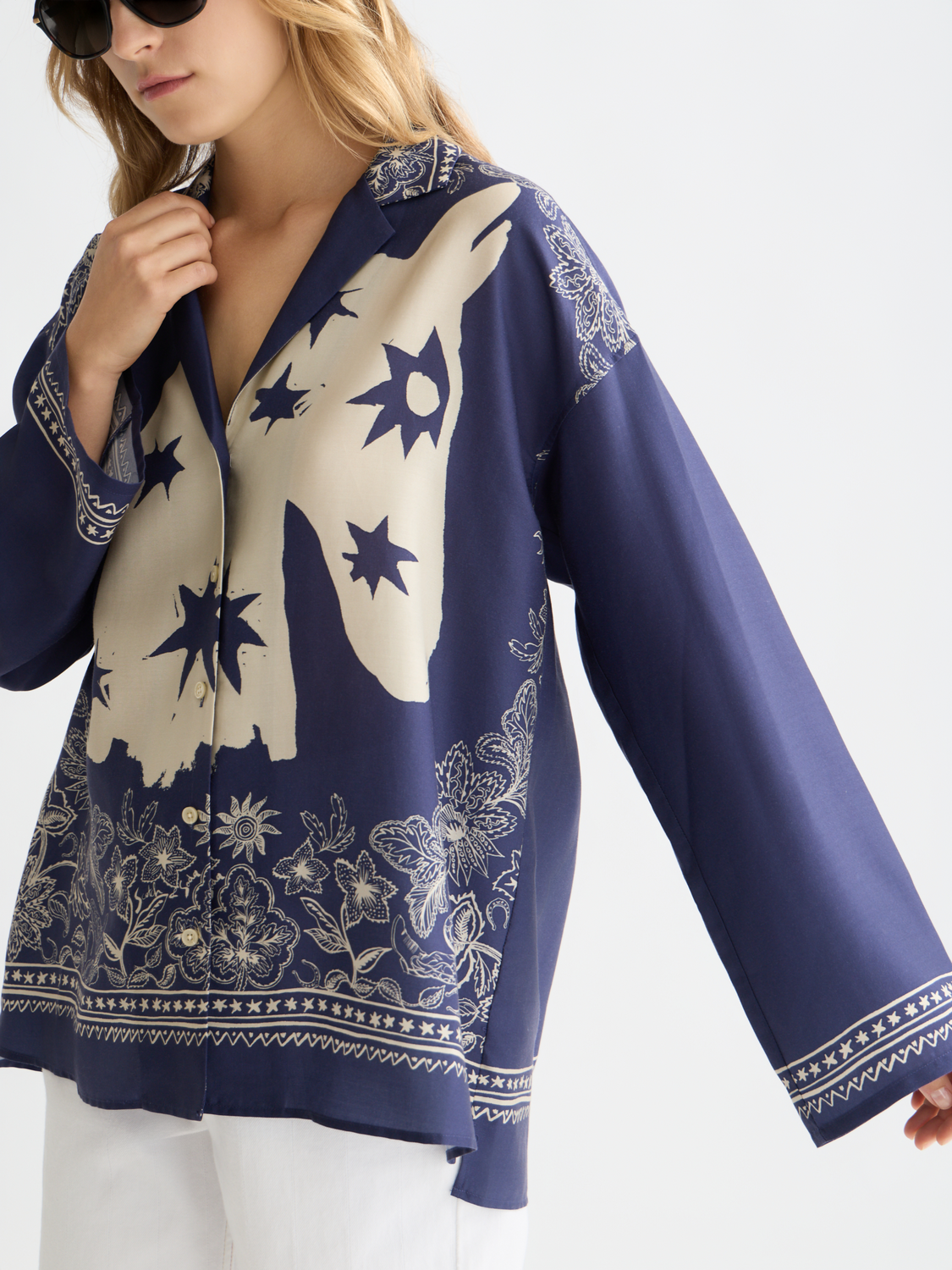 Long sleeve printed shirt by Scotch & Soda featuring a stylish pattern, displayed on a hanger against a neutral background.