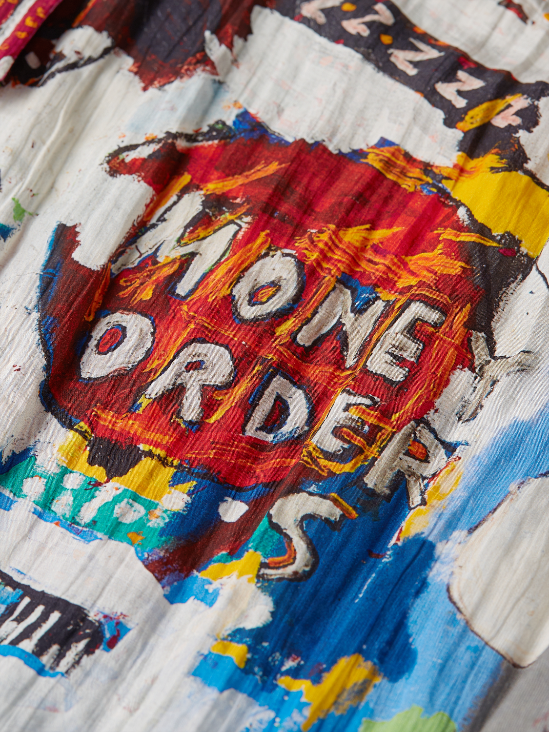 Long-sleeved S&S x Basquiat shirt by Scotch & Soda featuring bold graphic artwork, casual fit, and vibrant design details.