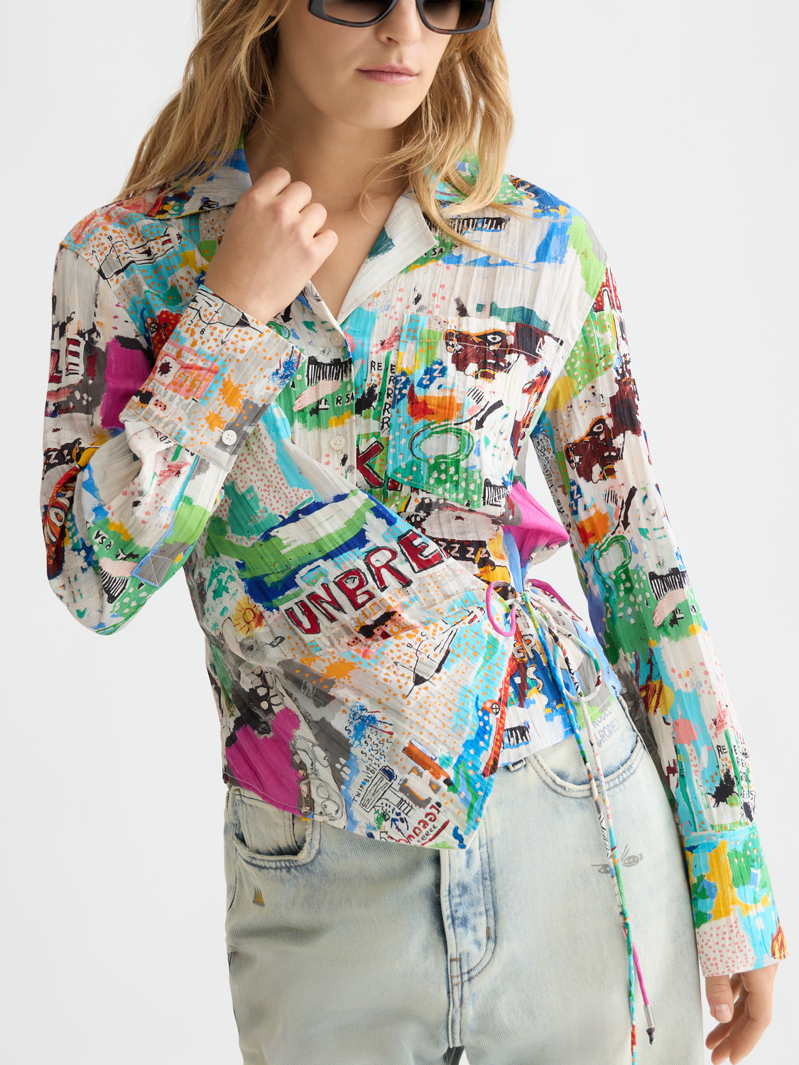 Long-sleeved S&S x Basquiat shirt by Scotch & Soda, featuring artistic print and casual fit, displayed on a mannequin.