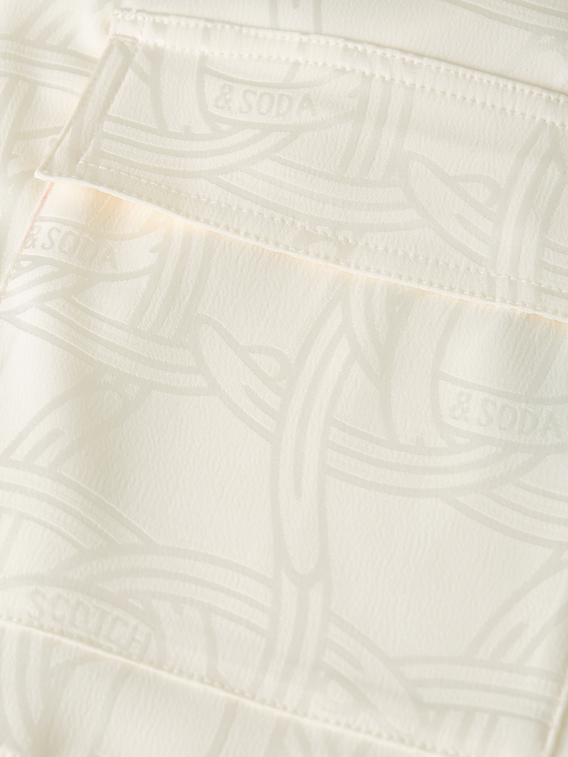 Long-sleeve utility shirt by Scotch & Soda featuring functional pockets and casual style, shown in a neutral color.