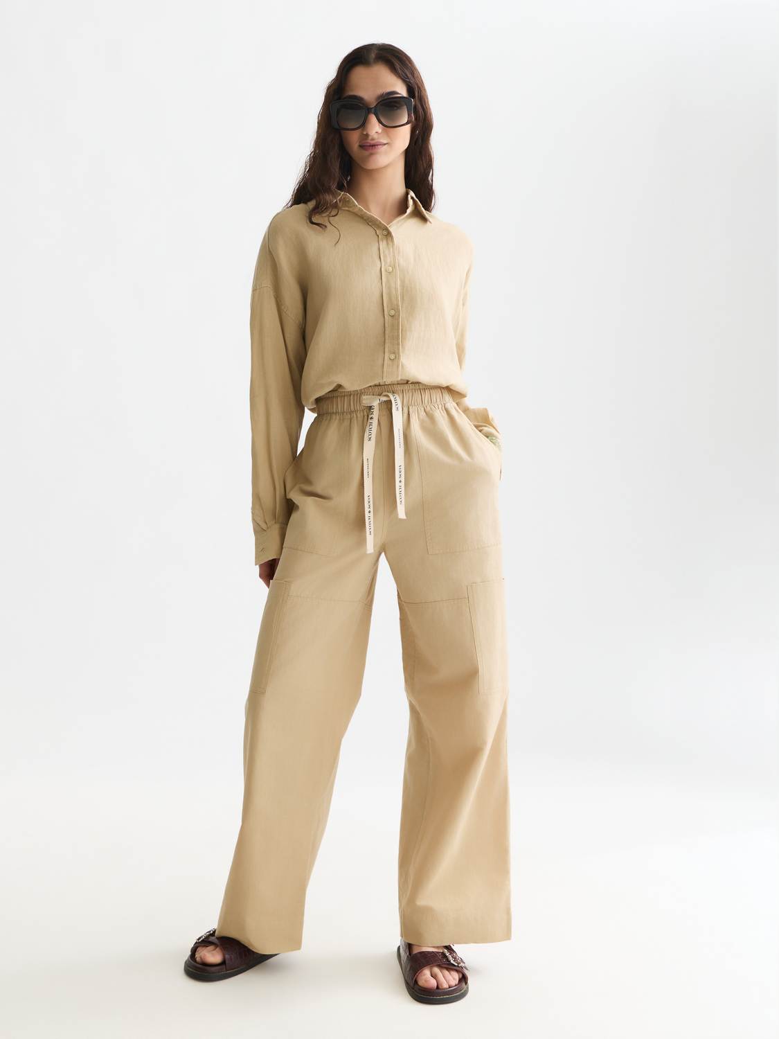 Long sleeve linen shirt from Scotch & Soda featuring a relaxed fit, natural fabric, and classic collar design.