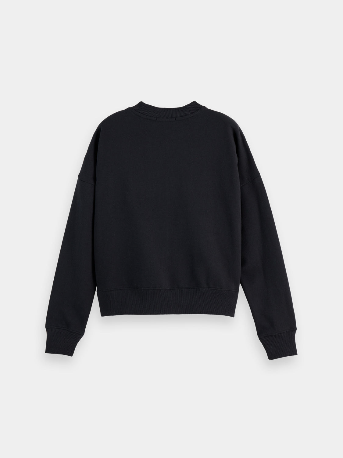 SCOTCH & SODA chest artwork sweatshirt showing a stylish black sweatshirt with graphic design on the front.