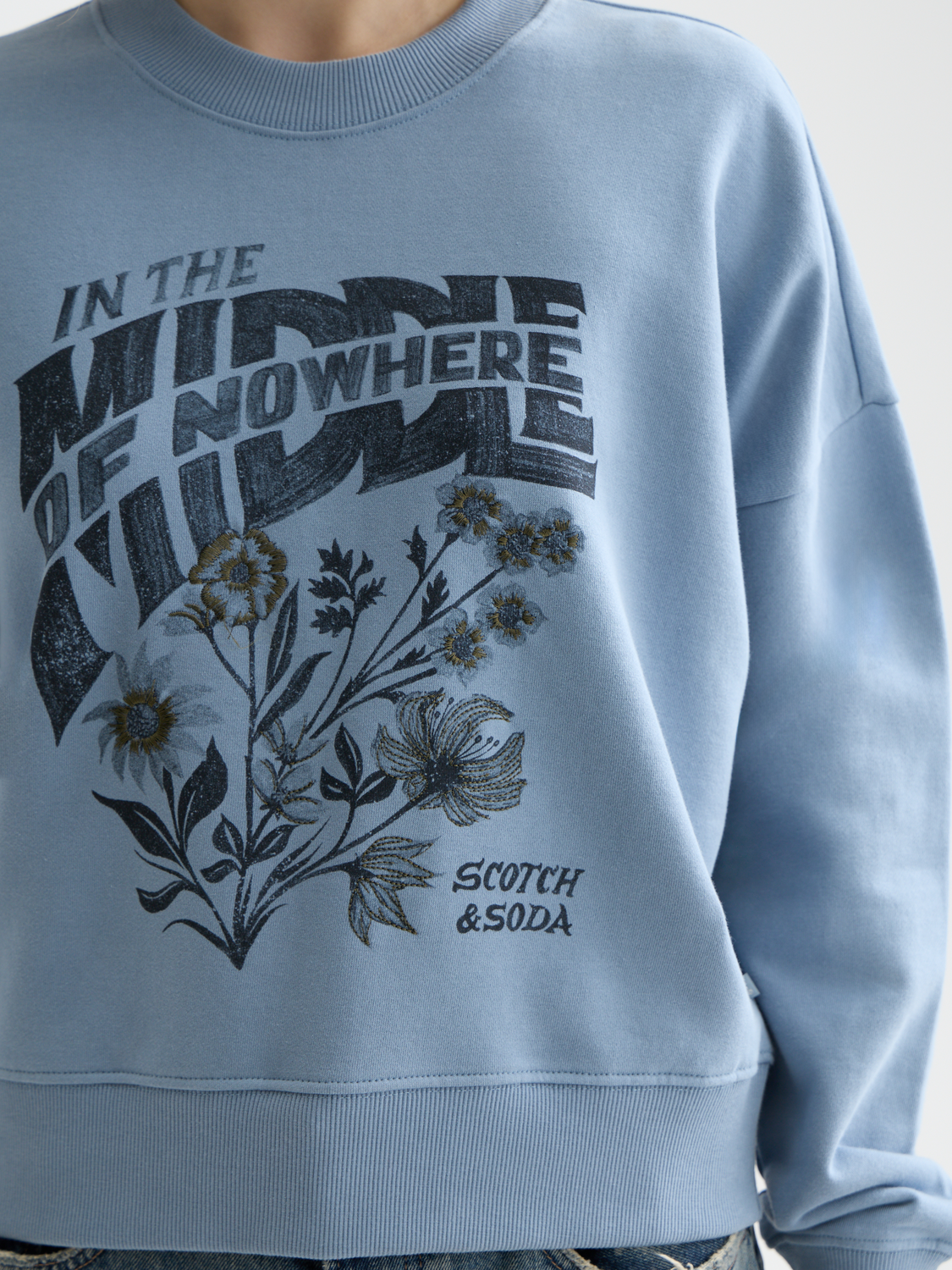 Gray sweatshirt from Scotch & Soda featuring a chest artwork design, casual fit, and soft fabric for comfortable wear.