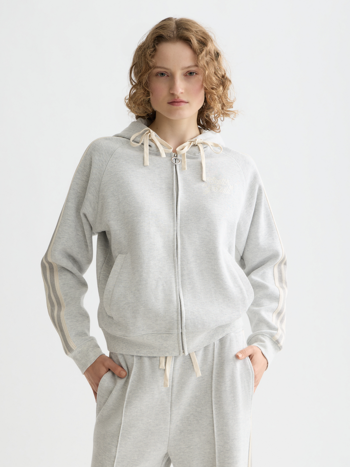 Black zip-through hoodie from Scotch & Soda, casual sweatwear with a front zipper and hood, displayed on a model.