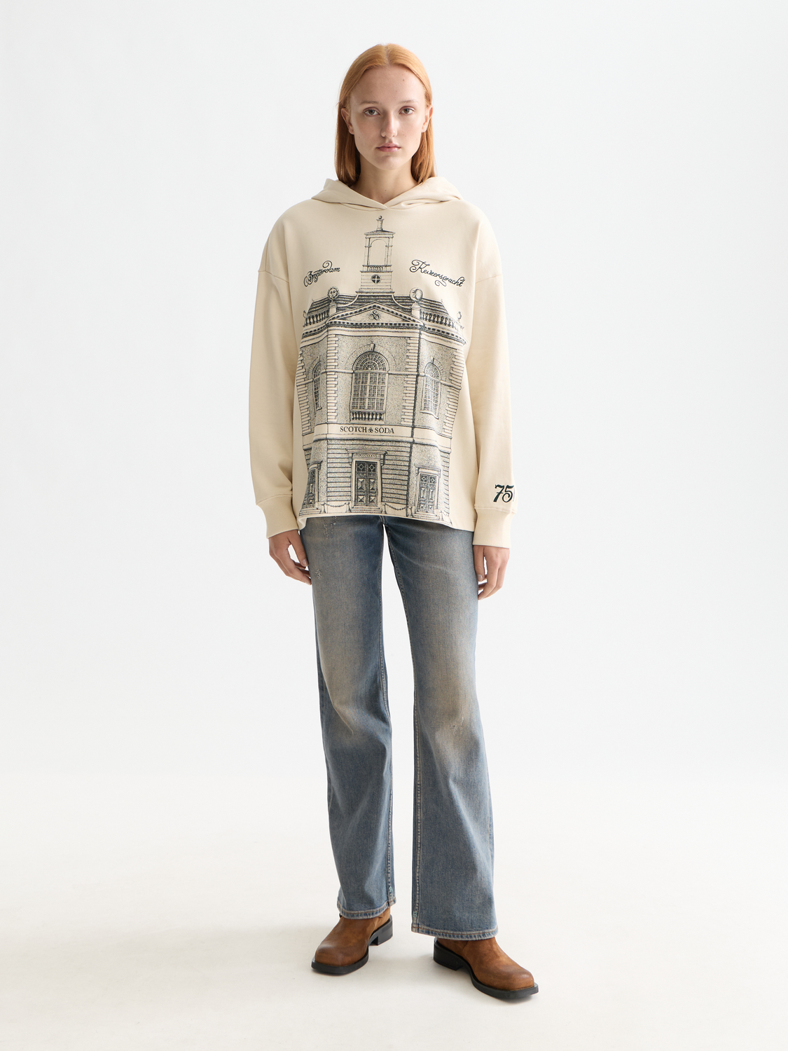 Artistic hoodie from Scotch & Soda featuring vibrant sweatshirt design and comfortable fit, displayed on a model.