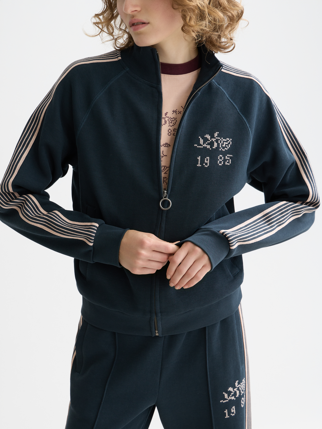Gray zip-through sweatshirt from Scotch & Soda, featuring a front zipper and casual fit, displayed on a model.