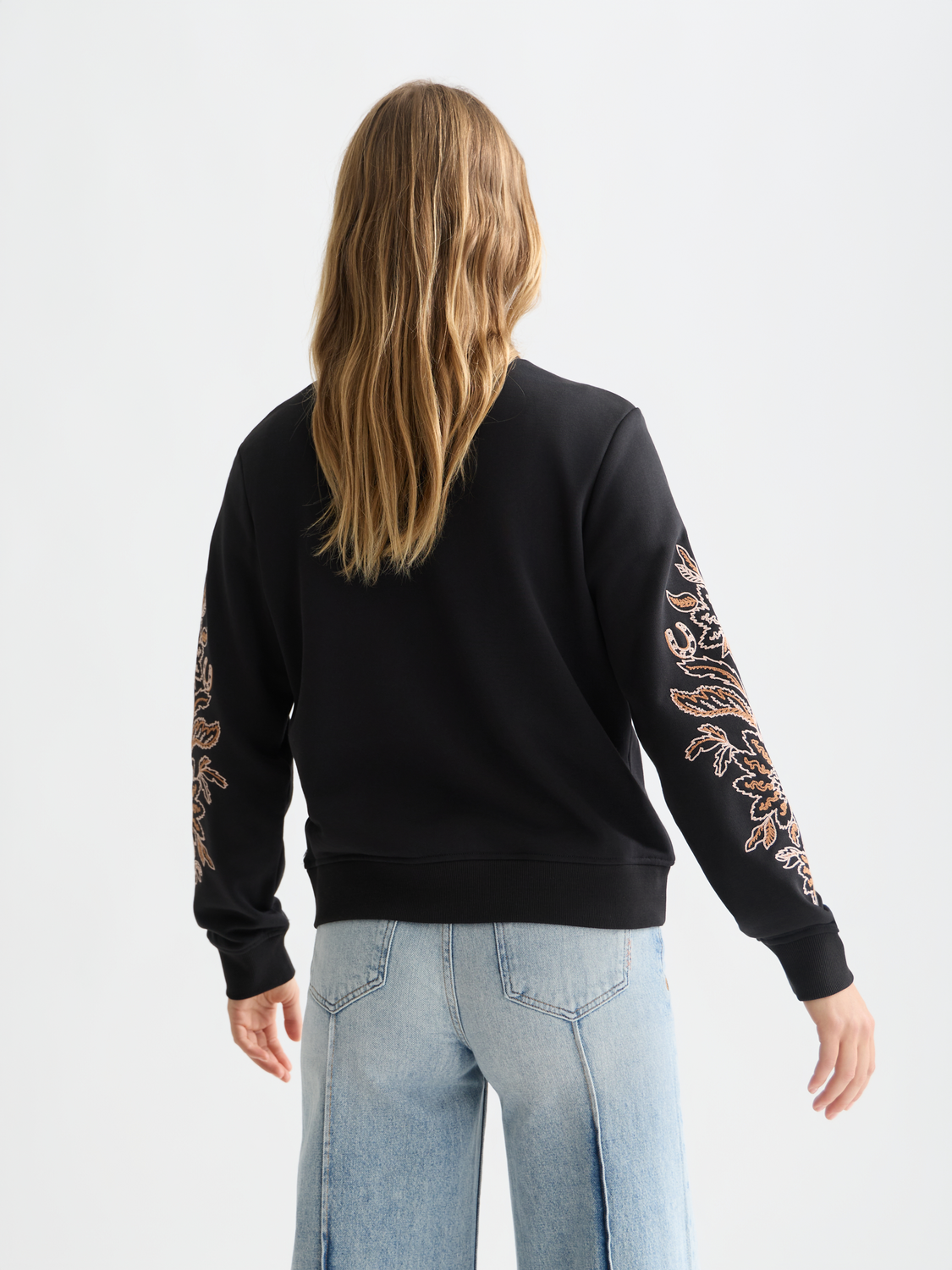 Embroidered sweatshirt by Scotch & Soda, showing detailed front embroidery and cozy fit in a casual sweatshirts style.