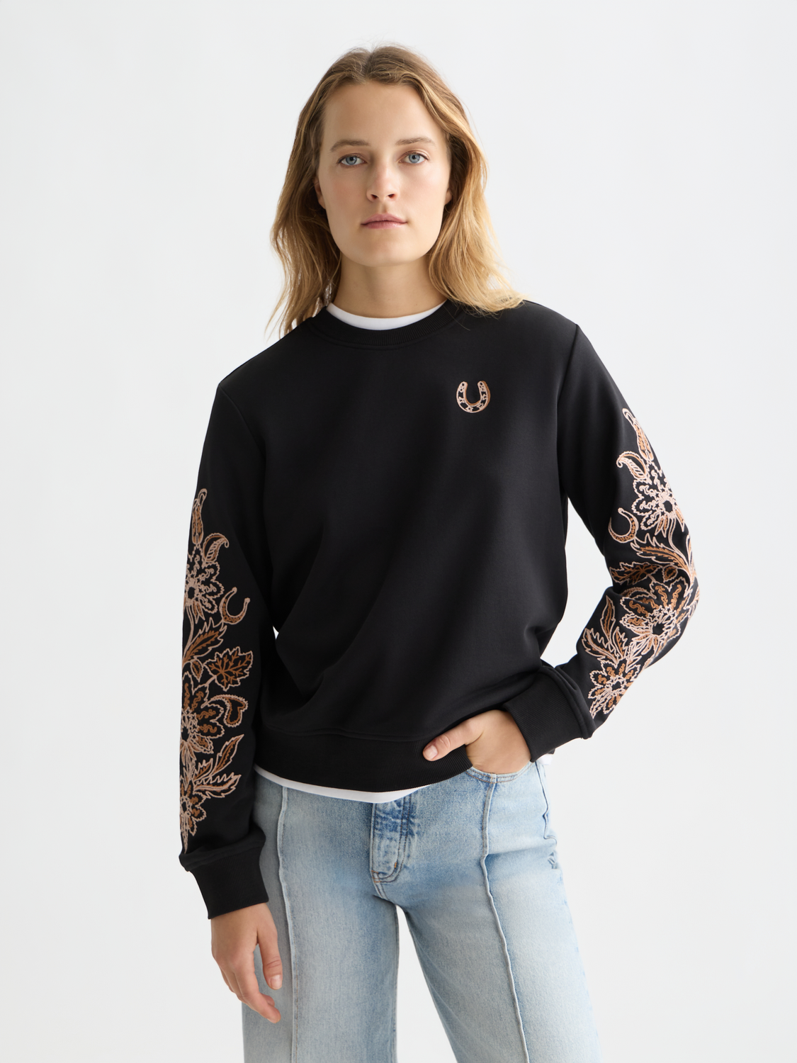 Embroidered sweatshirt from Scotch & Soda with colorful floral embroidery on soft, casual sweats fabric.
