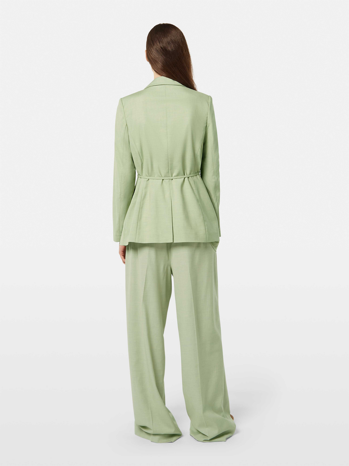 Scotch & Soda belted blazer, tailored fit with notched lapel, front pockets, and waist belt, worn by a model.