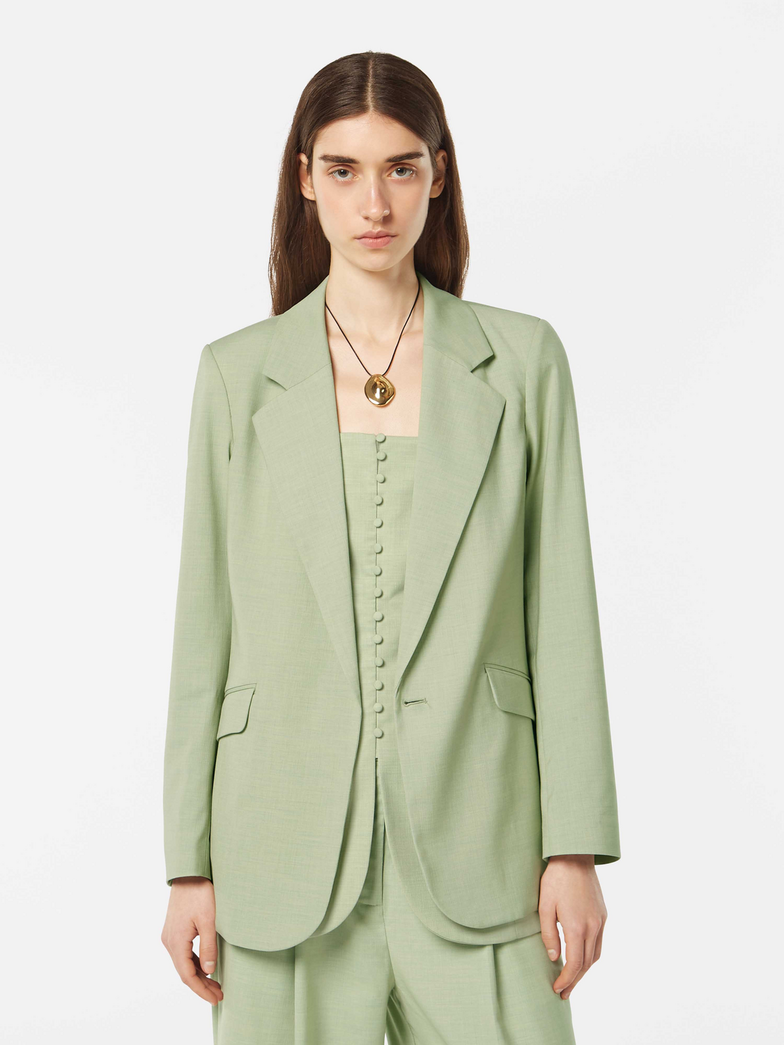 SCOTCH & SODA belted blazer with tailored fit, featuring a classic lapel collar and button closure, styled on a model.