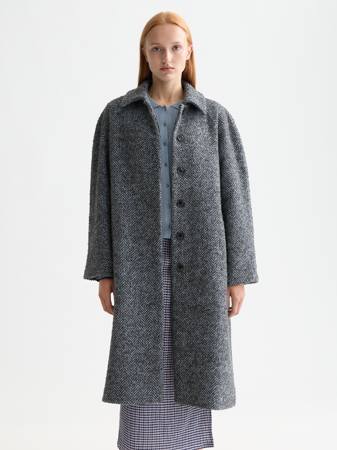 Wool blend Scotch & Soda carcoat jacket in neutral color, featuring classic collar and button closure, displayed on a hanger.