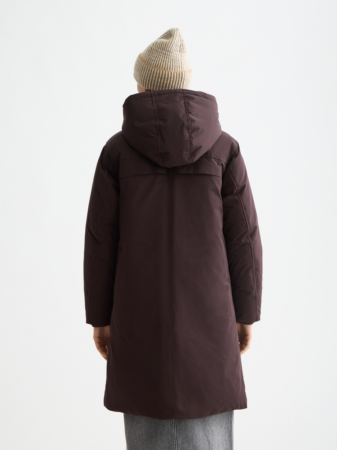 SCOTCH & SODA city parka jacket in dark color with hood, front pockets, and quilted lining, shown from the back.