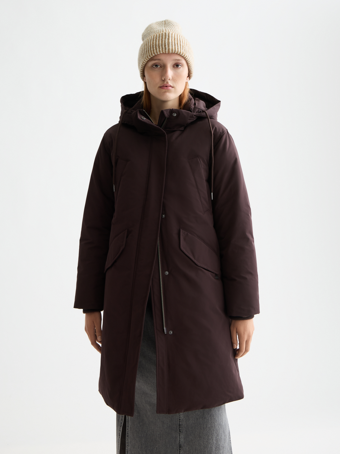 Scotch & Soda city parka jacket with hood, front zipper, and pockets, shown in a stylish urban design.