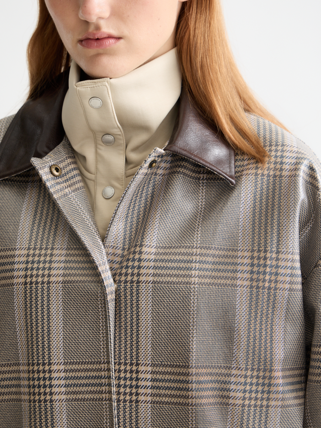 Blue Scotch & Soda coated raincoat with hood, featuring waterproof fabric and button closure, designed for rainy weather.
