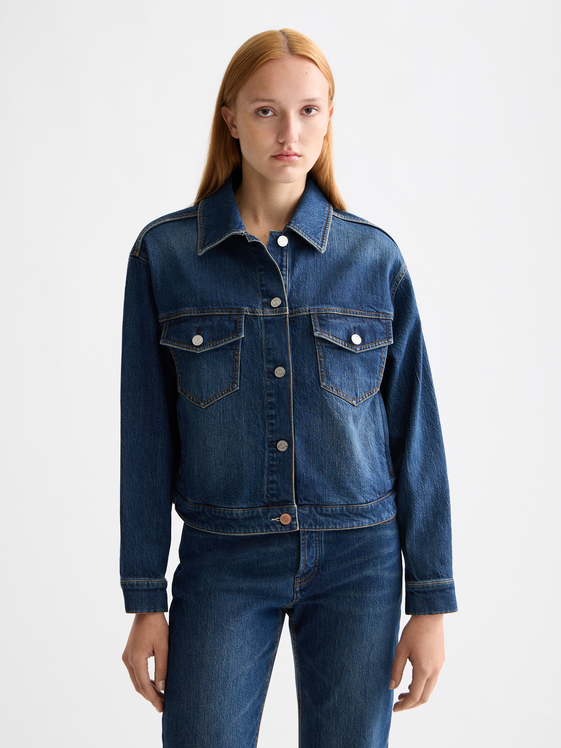 Cropped denim jacket by Scotch & Soda featuring classic blue wash, button front, and fitted style.