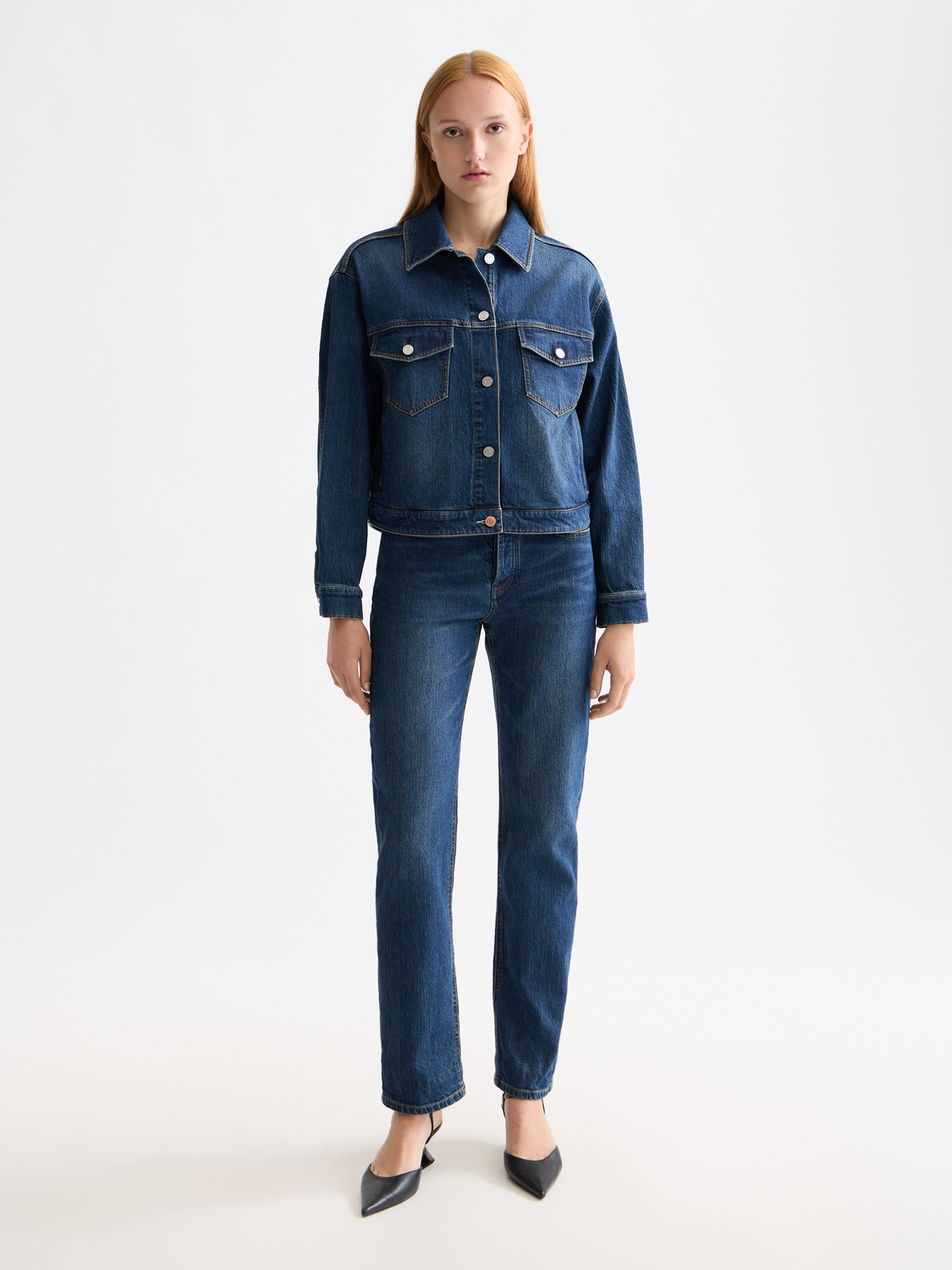 Cropped denim jacket by Scotch & Soda featuring a classic blue wash, button front, and stylish collar detail.