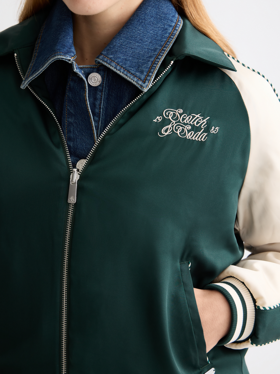 Reversible souvenir jacket by Scotch & Soda featuring vibrant patterns and casual style, worn open to show details.