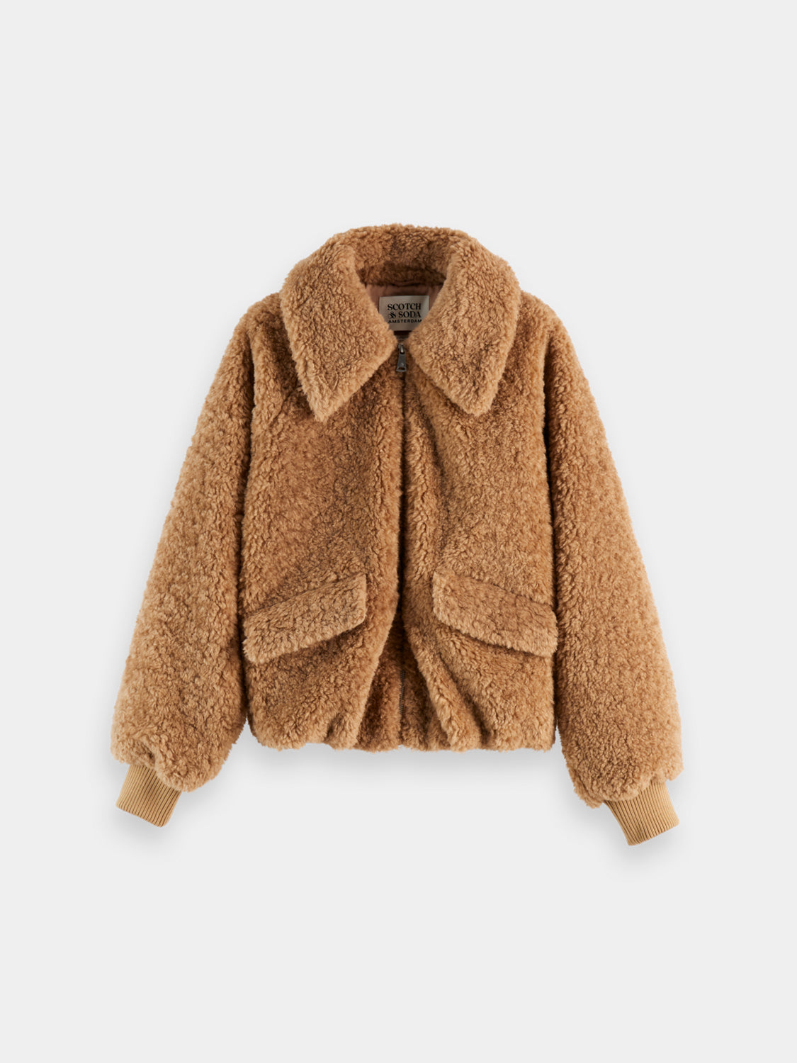 SCOTCH & SODA teddy bomber jacket with a plush, textured design, featuring a zip front and ribbed cuffs, displayed on a hanger.