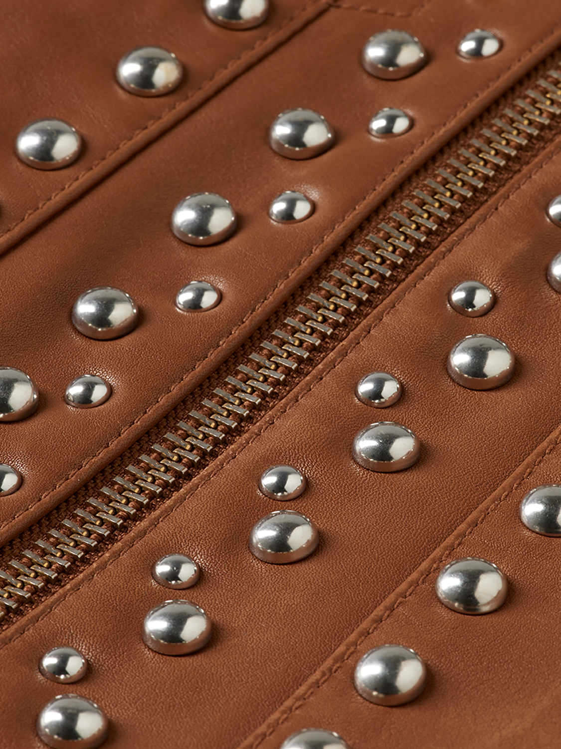 Leather trucker jacket from Scotch & Soda featuring classic design, button closure, and rugged leather material.