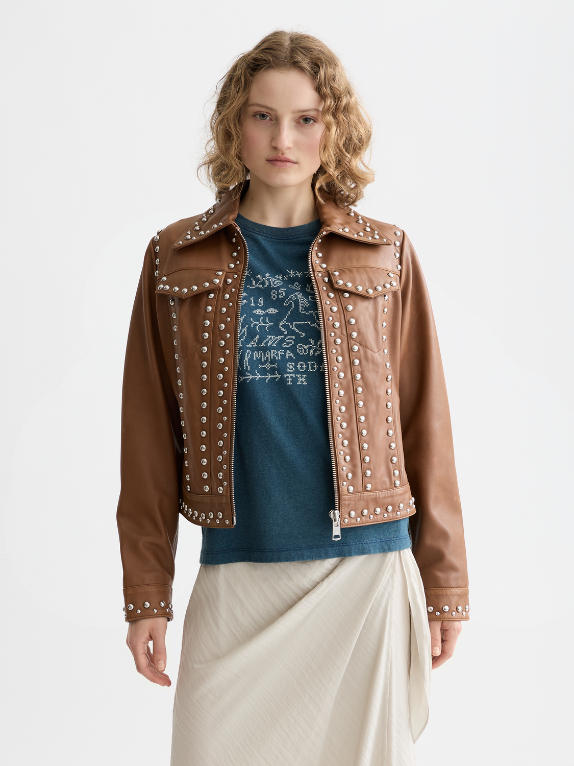 Leather trucker jacket by Scotch & Soda with classic collar, button front, and additional pocket details on a model.
