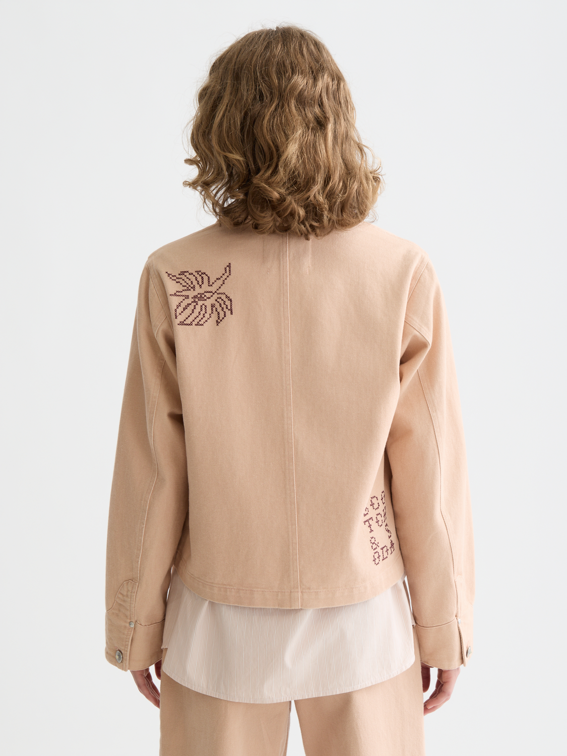 Embroidered SCOTCH & SODA jacket with detailed stitching, front view showing colorful embroidery on a stylish jacket.