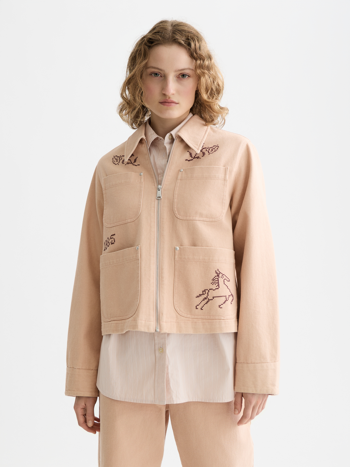 Embroidered SCOTCH & SODA jacket featuring colorful floral embroidery on a stylish jacket front.