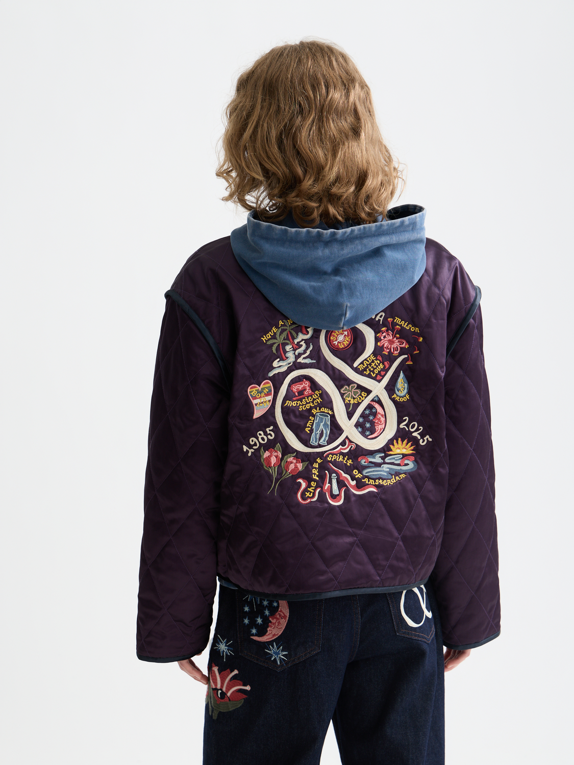 Reversible souvenir jacket by Scotch & Soda featuring bold patterns and vibrant design, shown from the back in this image.