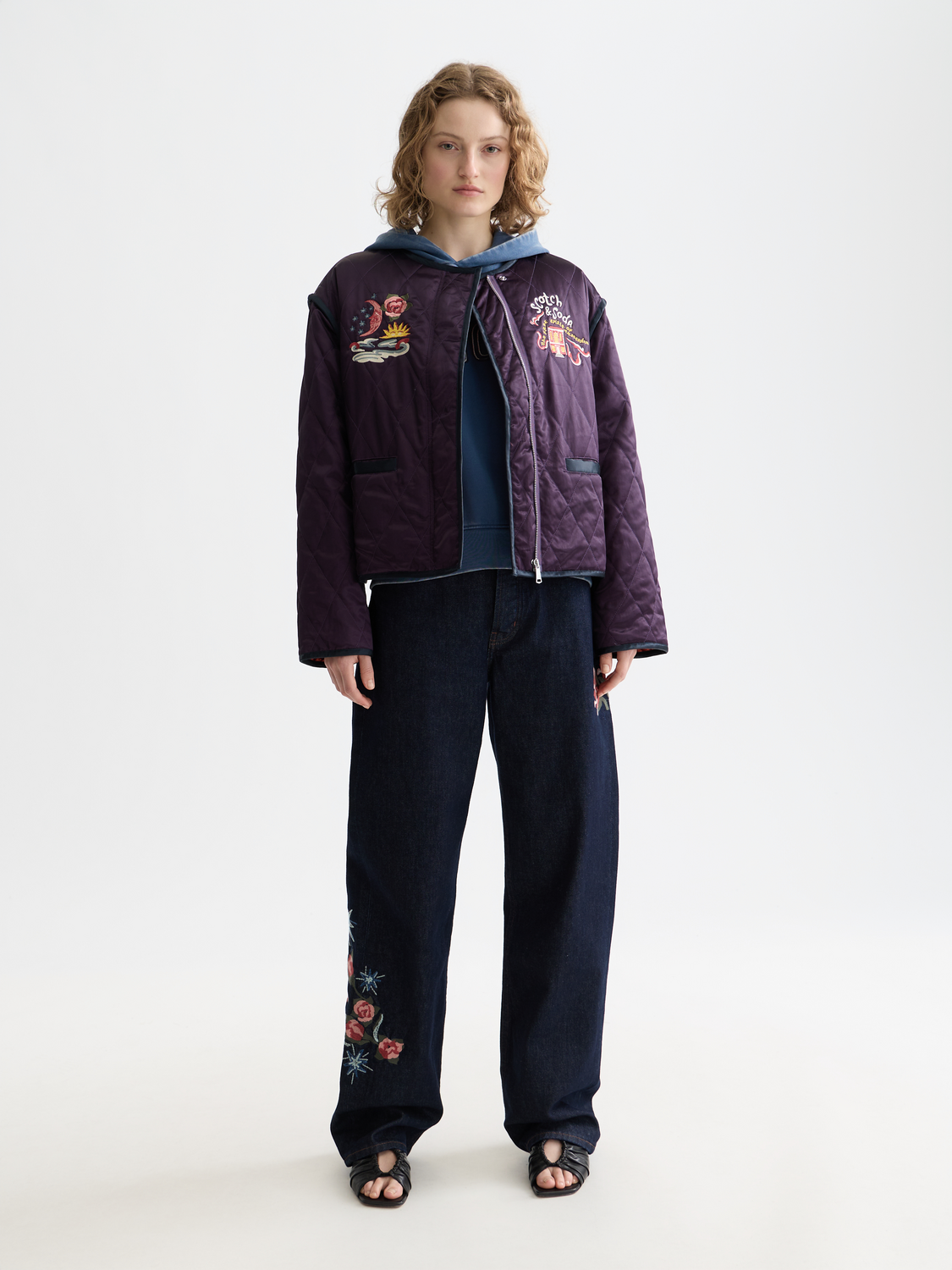 Reversible souvenir jacket by Scotch & Soda, featuring vibrant patterns and stylish design, displayed on a model.