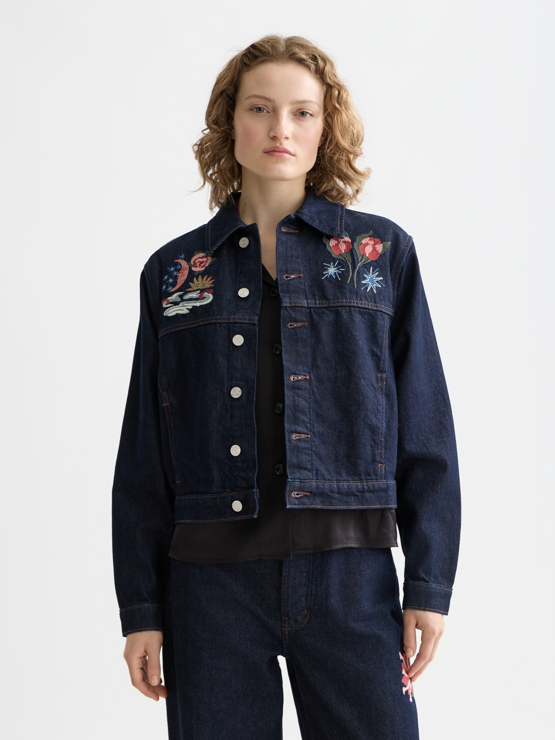 Embroidered denim jacket by Scotch & Soda featuring intricate embroidery on front, casual fit, and classic denim design.