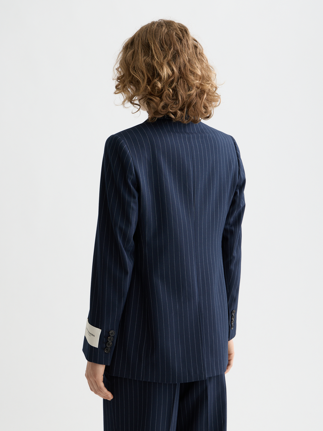 Single-breasted fitted blazer by Scotch & Soda, shown from the back, tailored with a sleek fit and classic lapel design.
